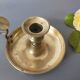brass candle holder with old cellar rat thumb