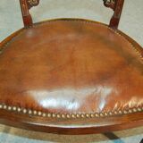 19th century armchair in leather and rosewood inlaid with brass and rosewood