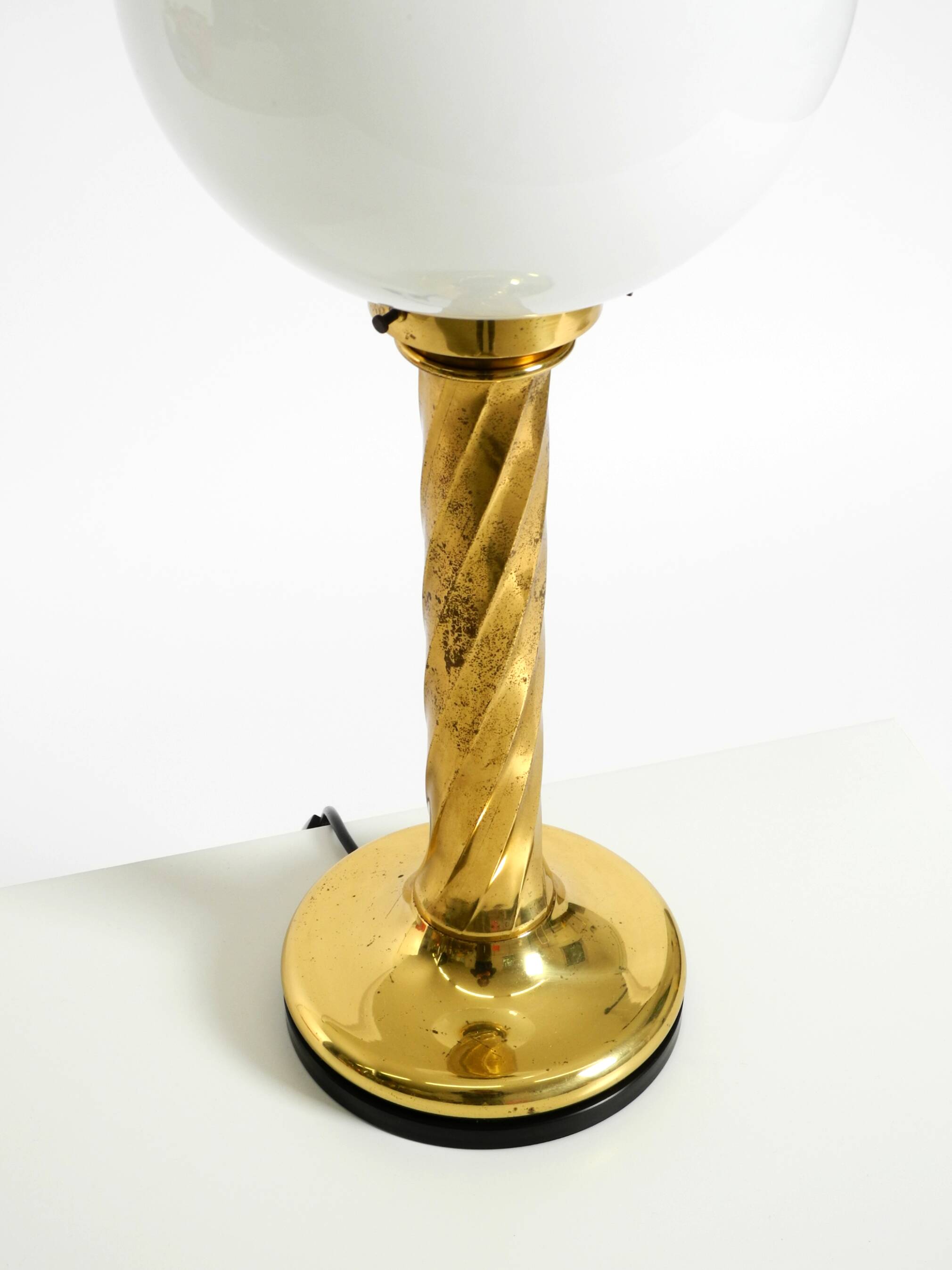 Large 1960s brass column-style table lamp with frosted glass globe