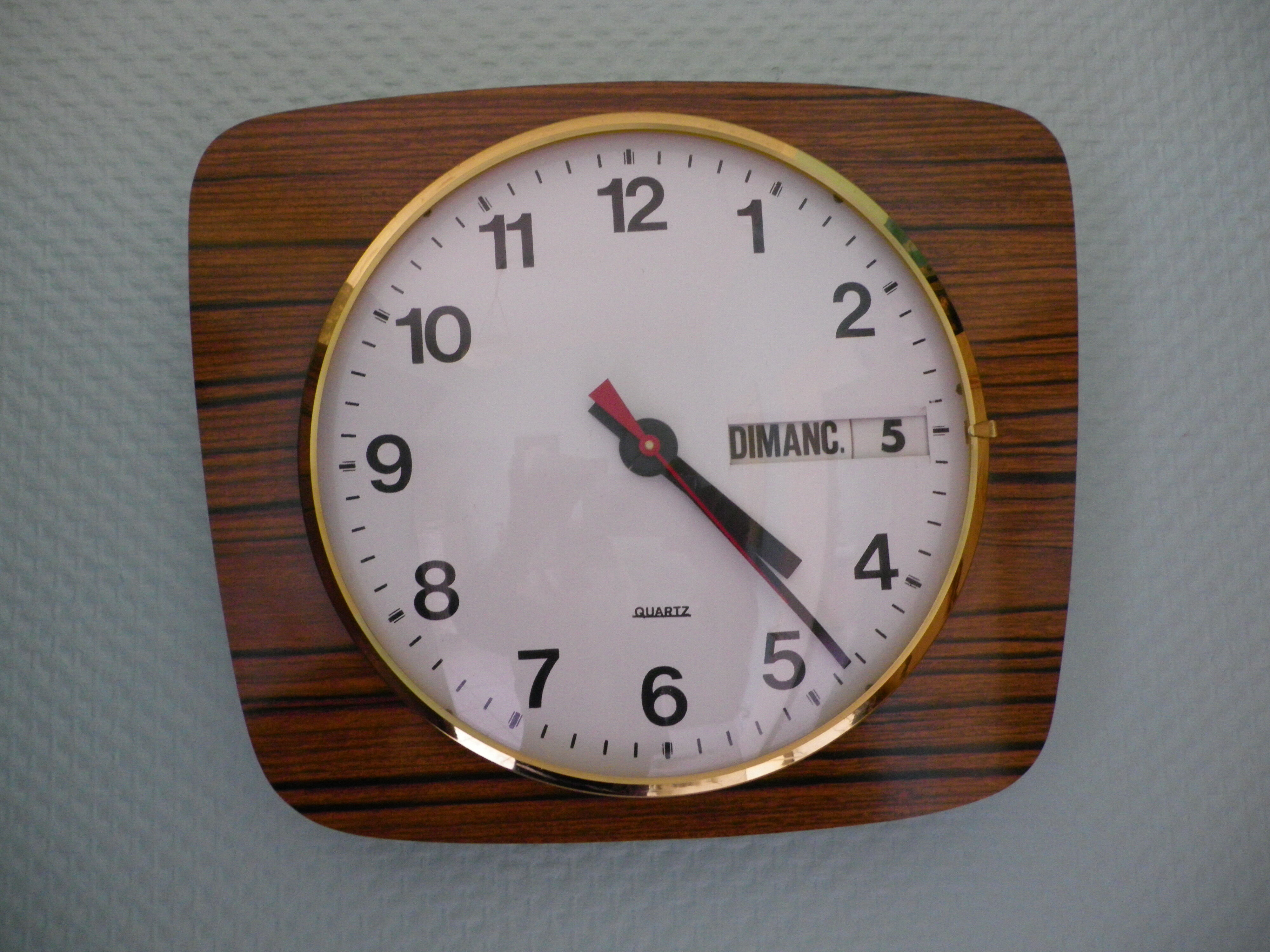 Formica wall clock with day and date - 1970s