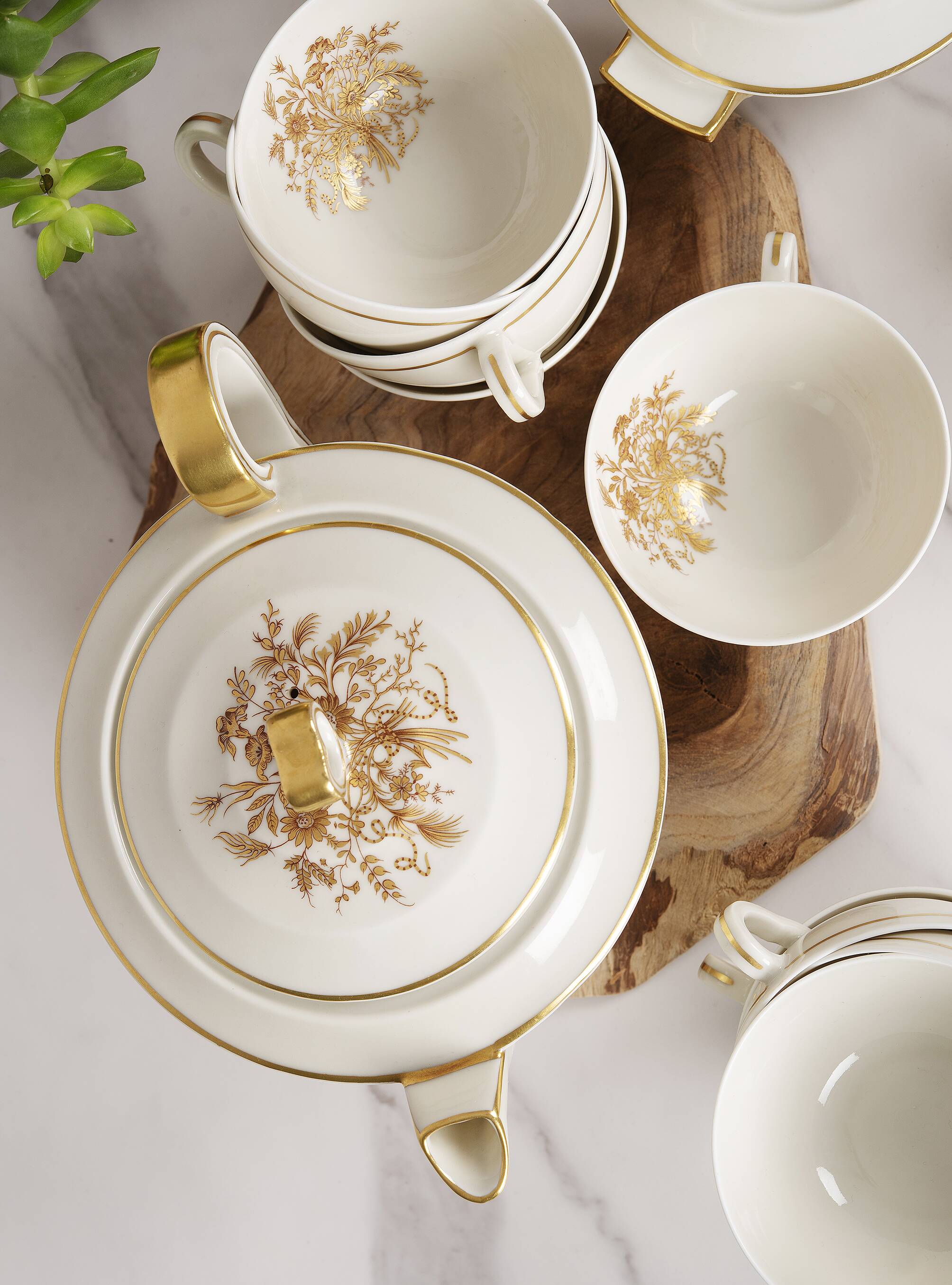 Porcelain tea service by Théodore Haviland, gilded patterns.