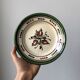 Very decorative serving plate in terracotta, floral and geometric motifs.