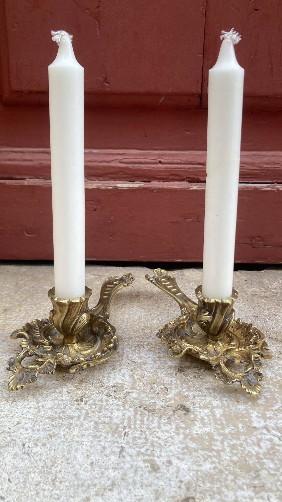 Pair of hand candlesticks / bronze candle holders