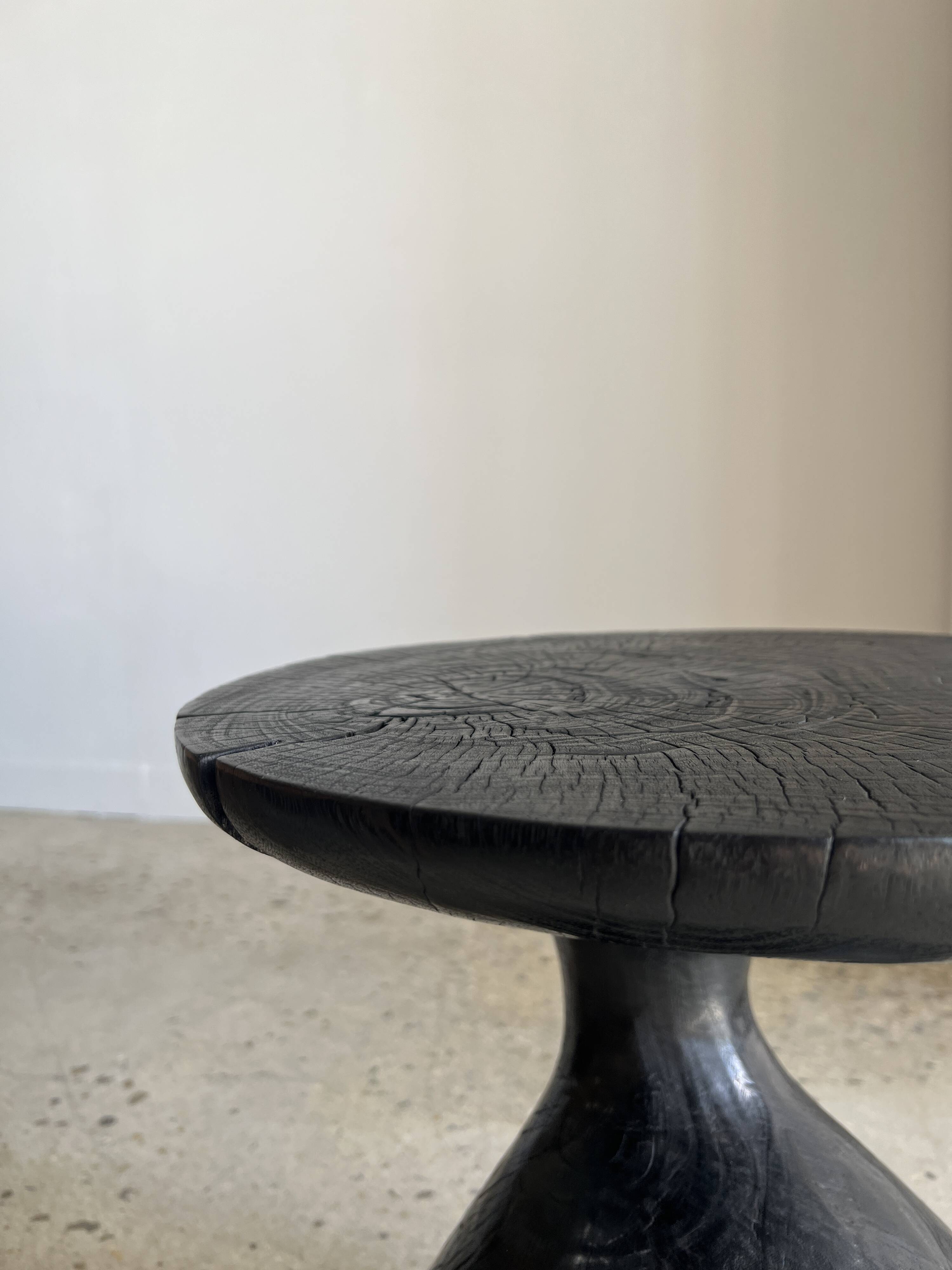Solid wood (monoxyl) side table, organic shape, black color