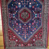 Small Persian wool rug
