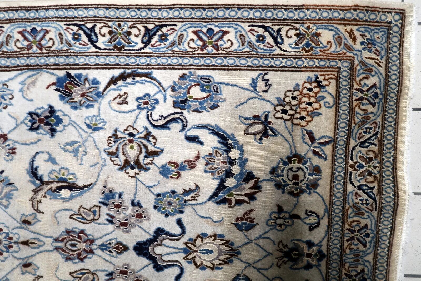 1950s hand-knotted wool rug with silk highlights, ivory and blue, 118 × 200 cm