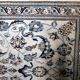 1950s hand-knotted wool rug with silk highlights, ivory and blue, 118 × 200 cm