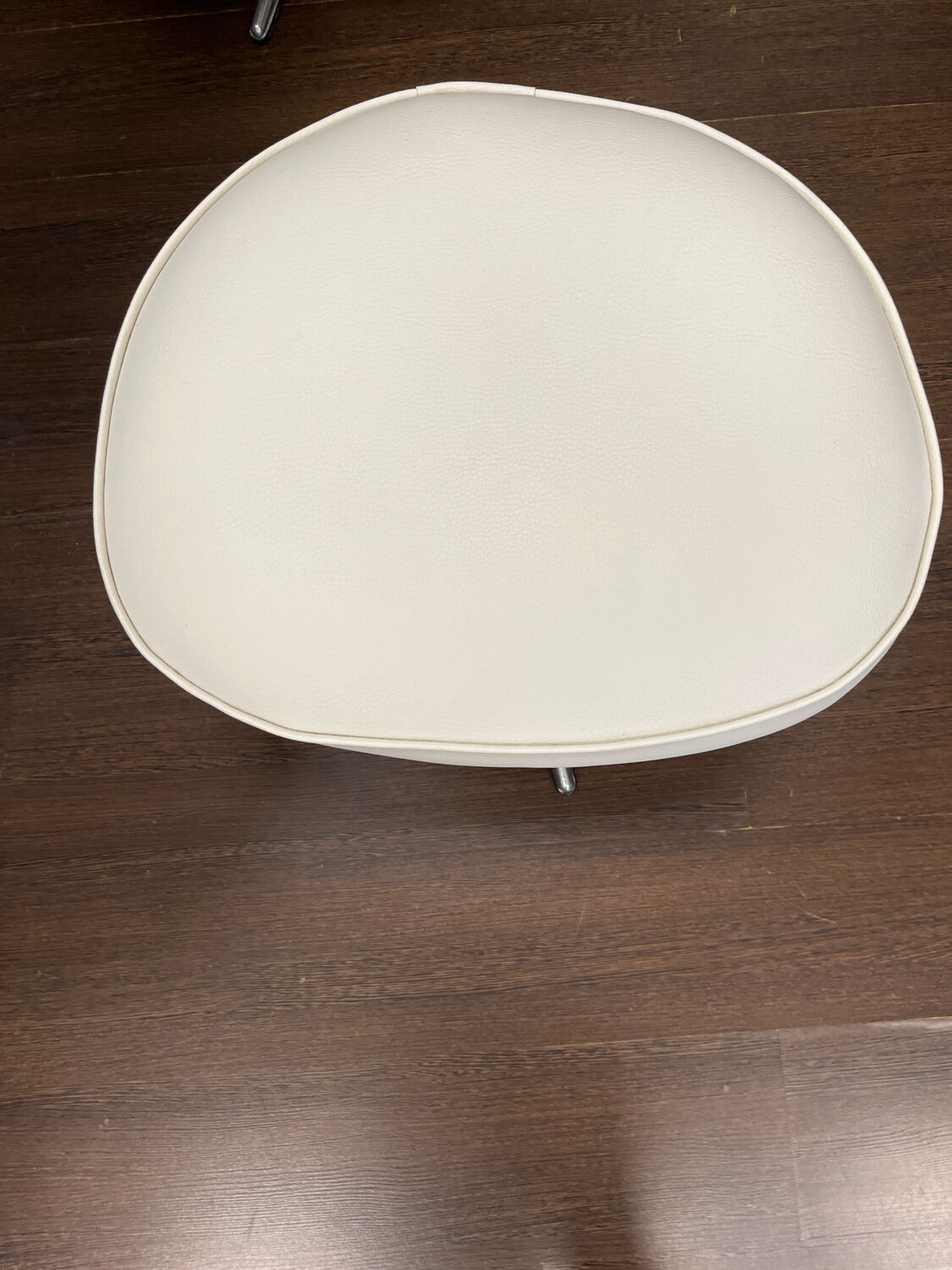 Old hairdressing chair and its footrest