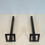 Pair of modernist andirons in steel and wrought iron