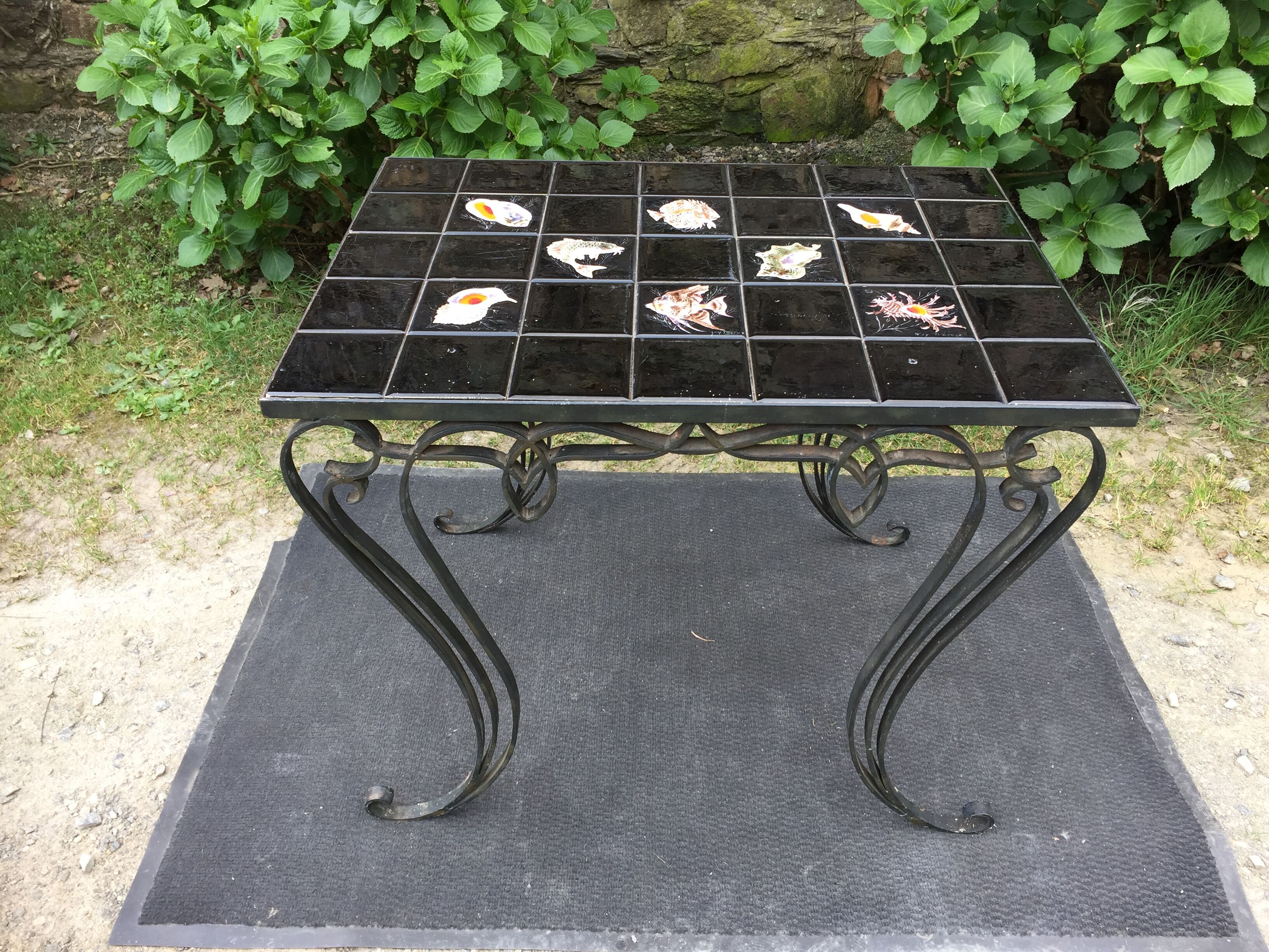 Vintage ceramic coffee table by Guy Trévoux with wrought iron base.