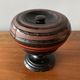Round covered standing box in lacquered wood, Japanese work of the 1930s.