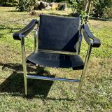 Paire de fauteuils en cuir et acier