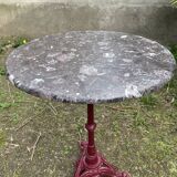 Bistro table with cast iron and marble legs