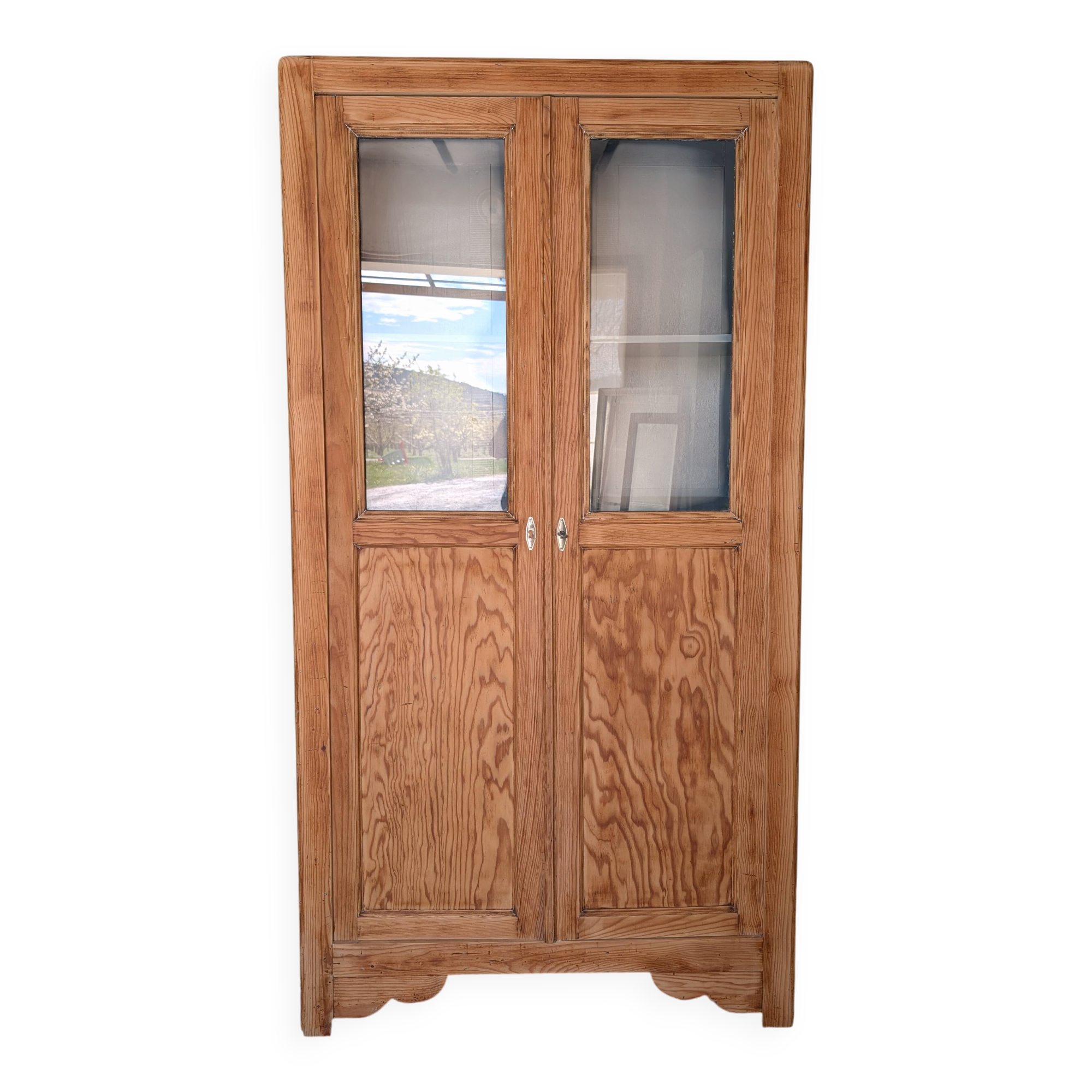Old glass-fronted wooden library – blue interior