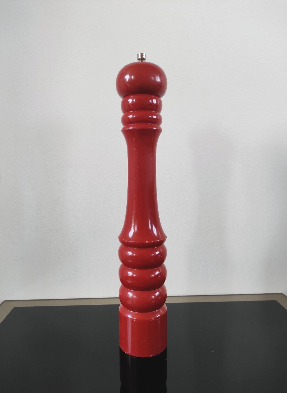 Giant vintage red lacquered wooden pepper mill