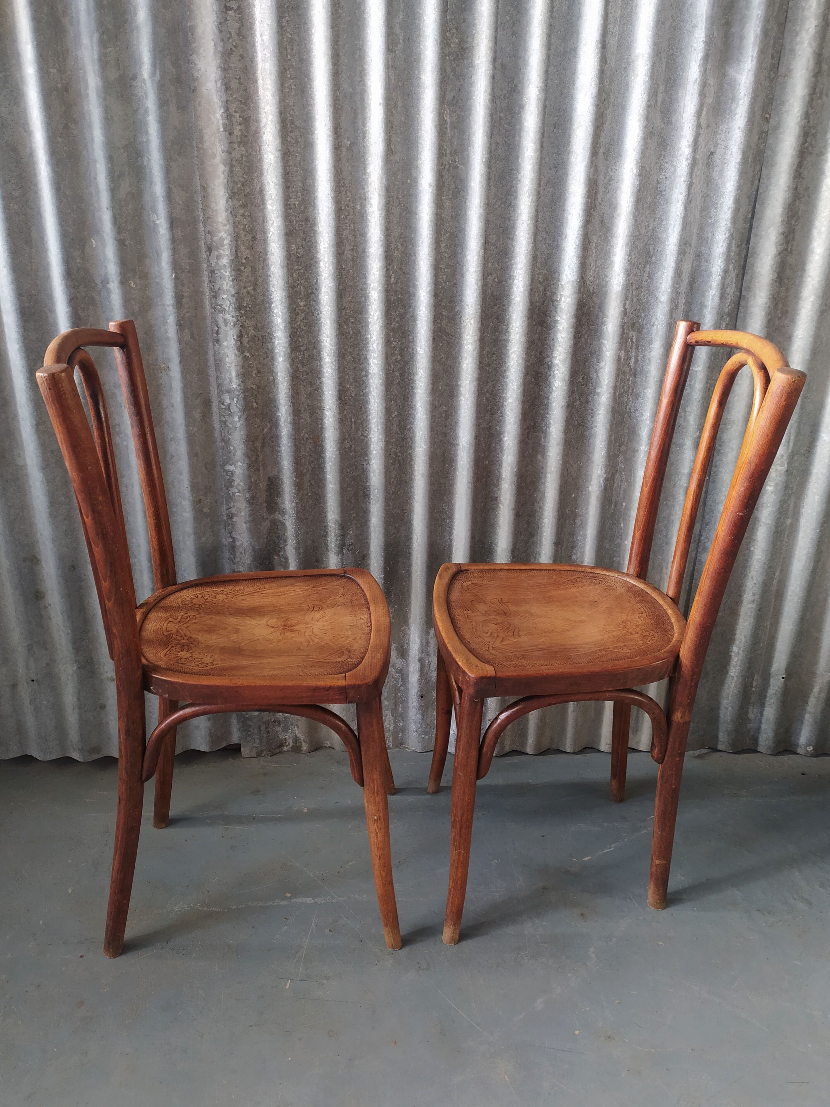Pair of curved wooden bistro chairs