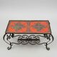 Vintage coffee table in glazed ceramic and wrought iron.