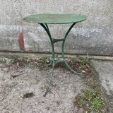 Riveted green old garden pedestal table