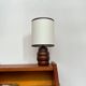 Turned wooden bedside lamp.