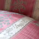 Pair of Louis XVI style armchairs in walnut and pink silk and ecru