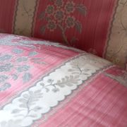 Pair of Louis XVI style armchairs in walnut and pink silk and ecru