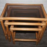 Rattan nesting tables in rattan and smoked glass from the 70s