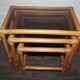 Rattan nesting tables in rattan and smoked glass from the 70s