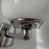 Chrome and opaline wall lights from the 70s.