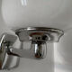 Chrome and opaline wall lights from the 70s.