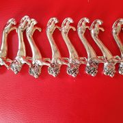 Set of 8 silver metal knife holders. Lion shape.