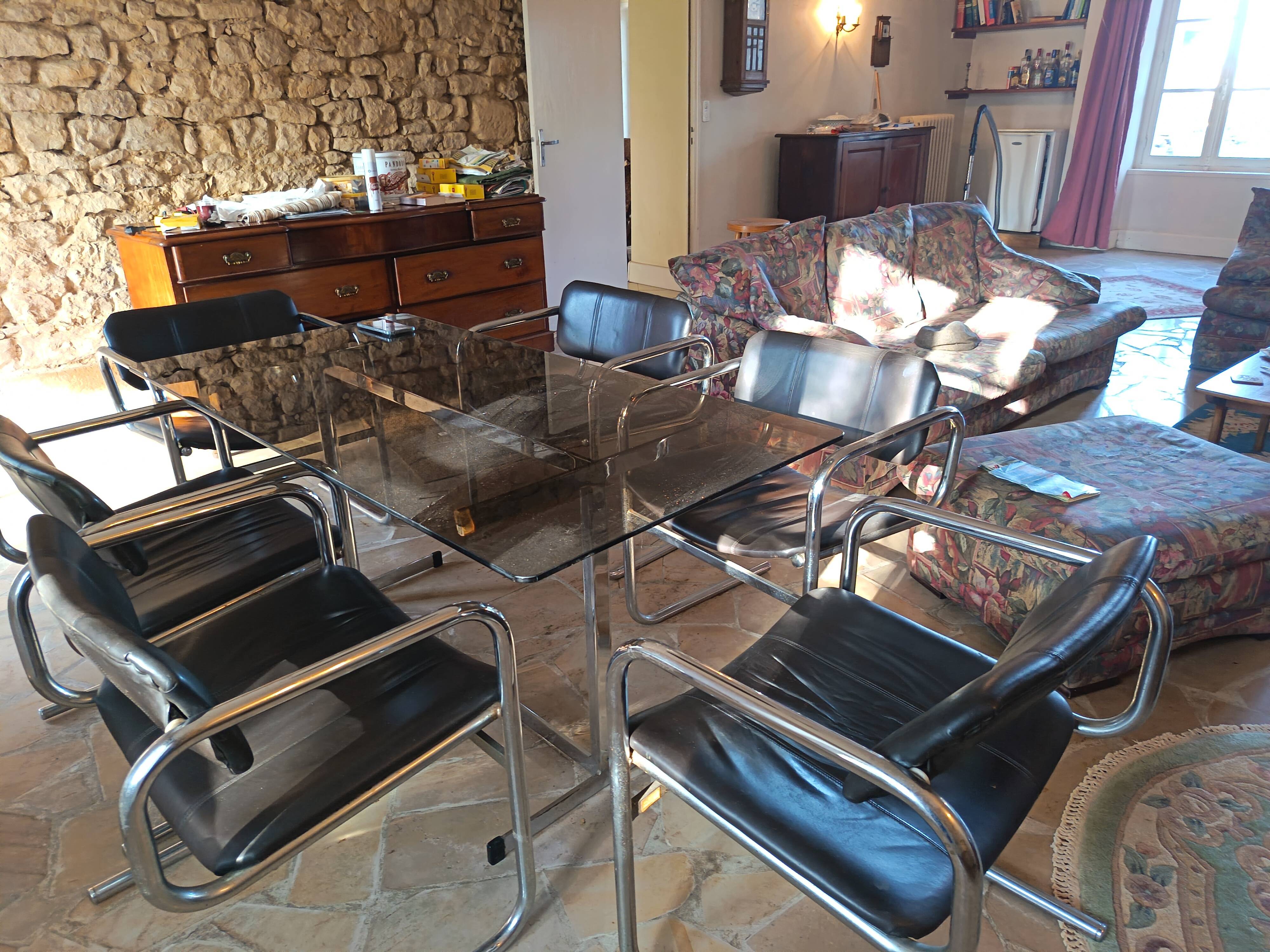 Dining table set with 6 Pieff chairs.