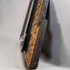 Antique wall mirror in blackened wood and gilded stucco, 19th-century Dutch style.