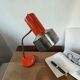 Vintage orange desk lamp with chrome accents.