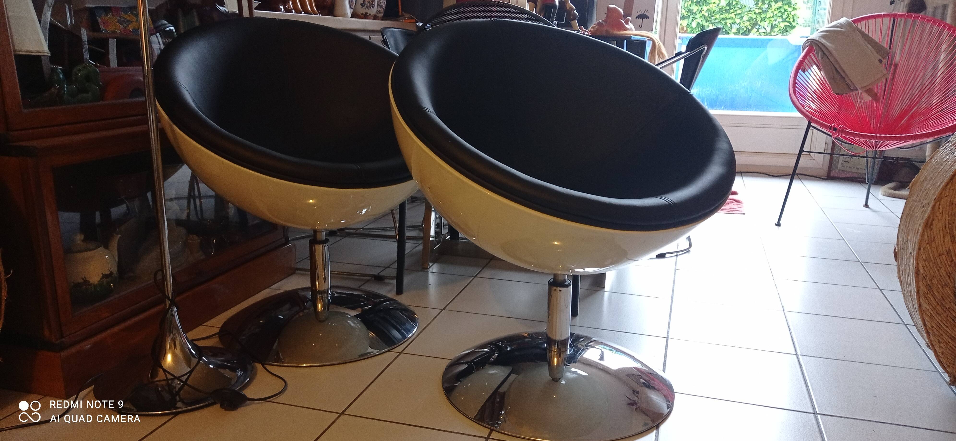 Pair of vintage white ball and black imitation leather swivel armchairs