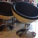 Pair of vintage white ball and black imitation leather swivel armchairs