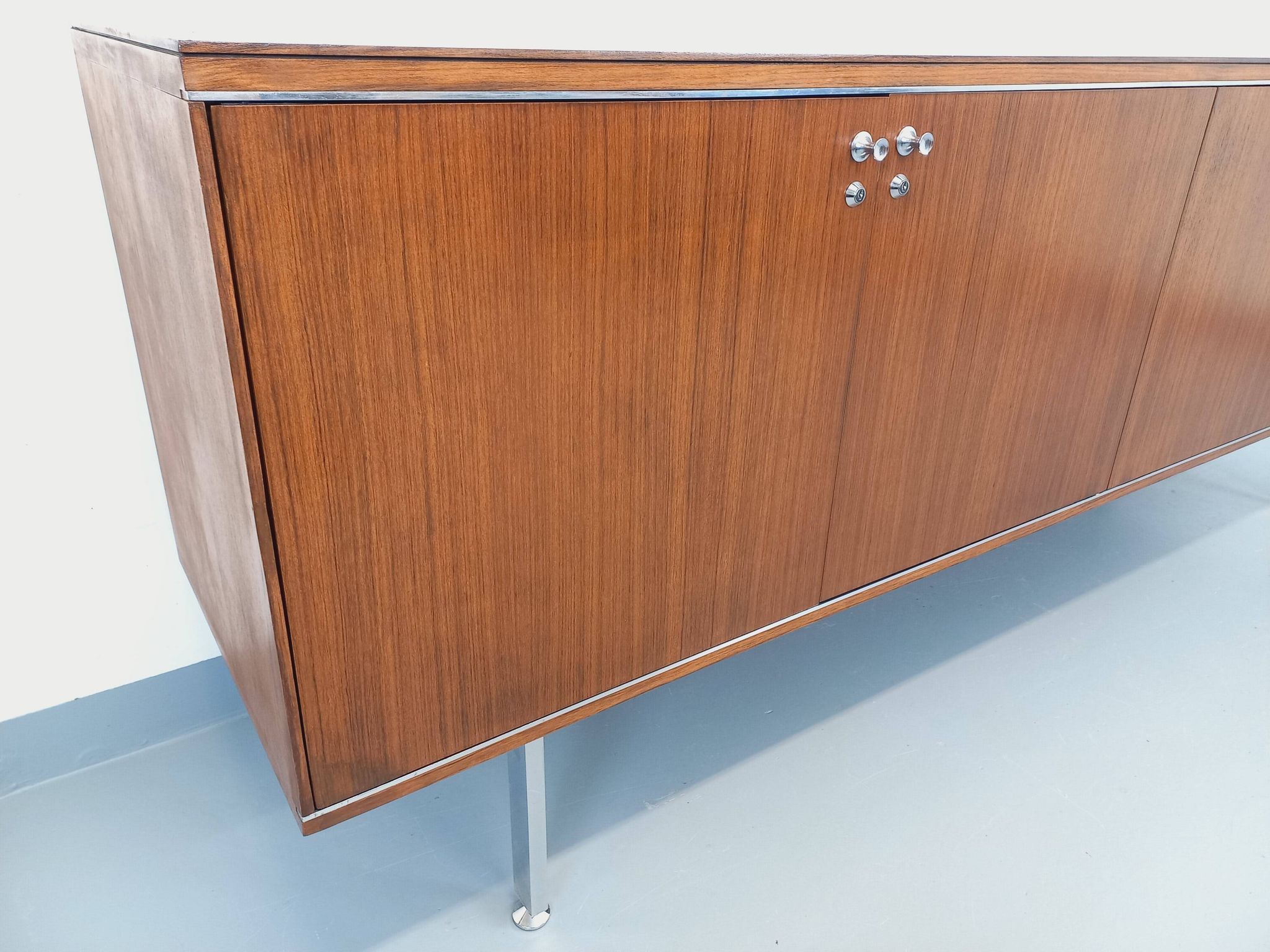 Vintage modernist enfilade in rosewood and chrome metal from the 60s and 70s.
