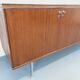 Vintage modernist enfilade in rosewood and chrome metal from the 60s and 70s.