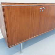 Vintage modernist enfilade in rosewood and chrome metal from the 60s and 70s.