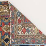 Antique tissé à la main - Tapis persan à fond bleu avec des figures ressemblant à des oiseaux