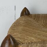 Brutalist wood turned bobbin low rush chair in the style of Charles Dudouyt