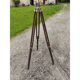 Spotlight on wooden and chrome tripod.