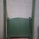 Directoire style bed in painted green wood.