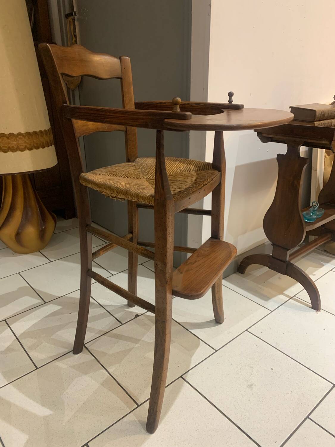 Antique straw-covered high chair