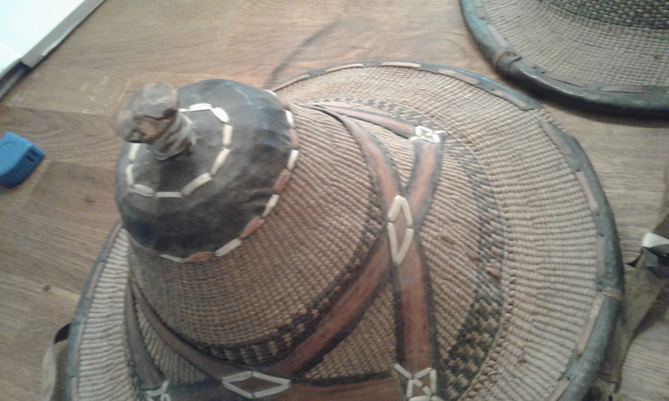 Old colonial hat in braided straw and leather