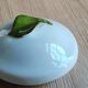 Porcelain jam pot with hand-painted plum design, signed sweet jar.