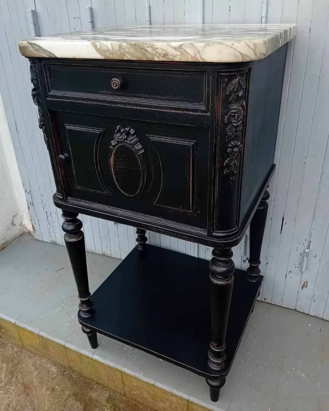 Romantic black bedside table with patinated marble and wood
