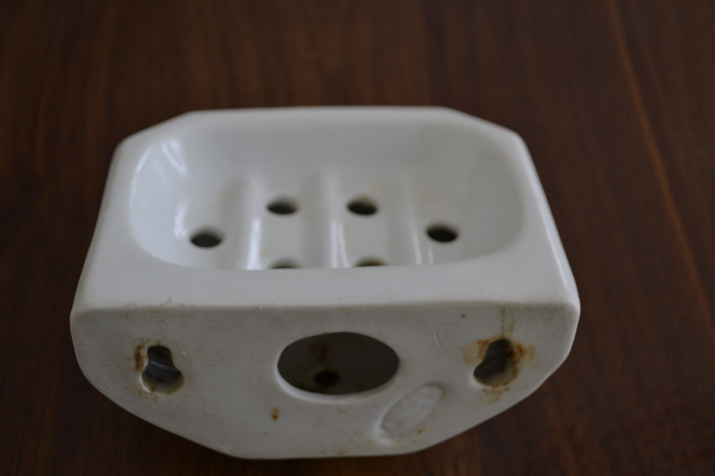 White ceramic wall soap holder