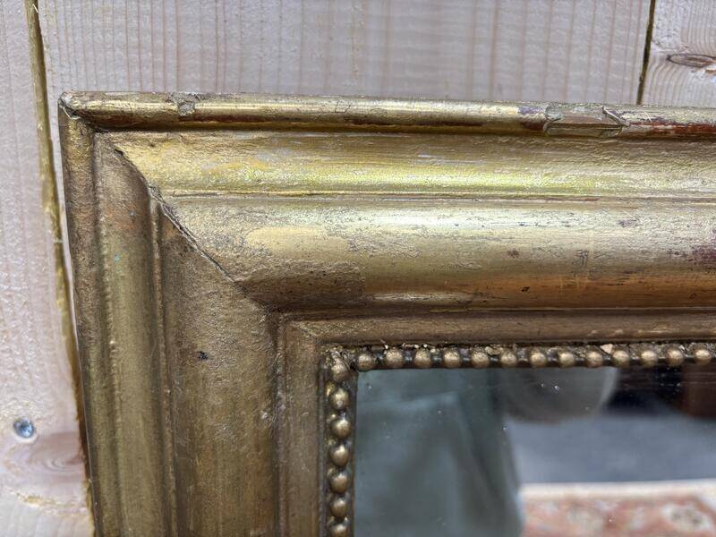 Miroir doré de style Louis XVI