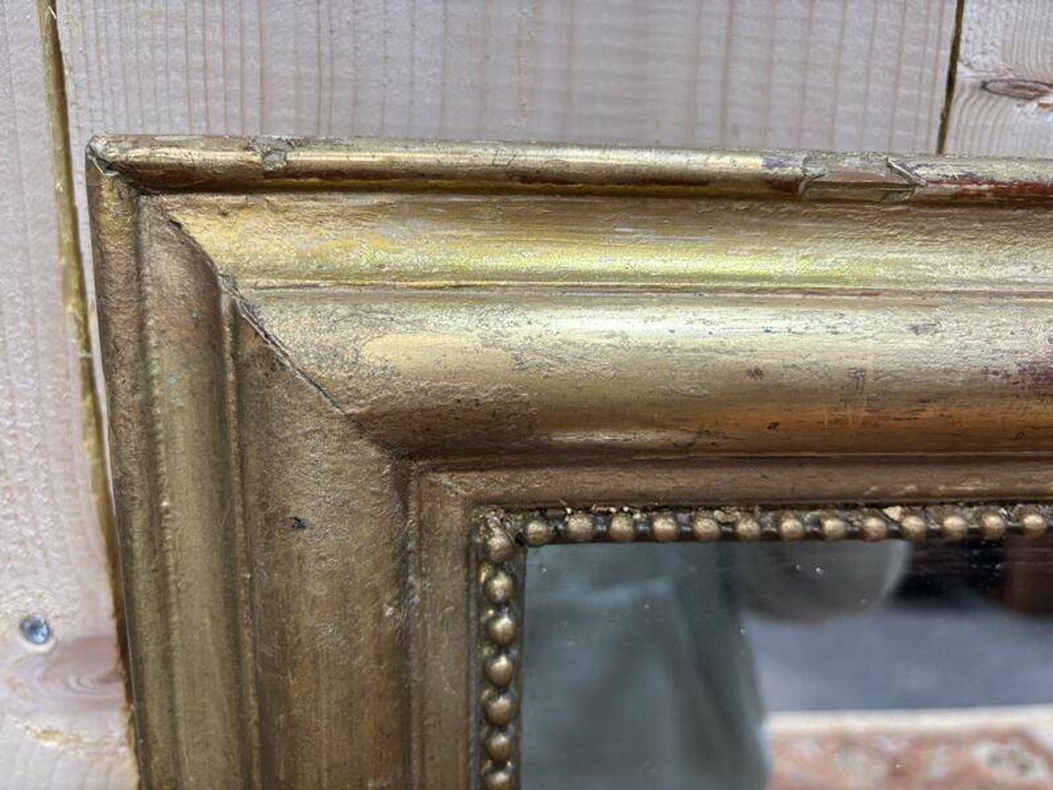 Miroir doré de style Louis XVI
