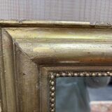 Miroir doré de style Louis XVI